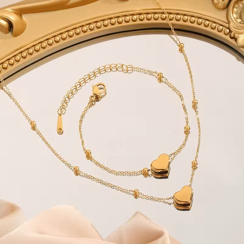 BRACCIALE E COLLANA A CATENA A FORMA DI CUORE COLOR ORO