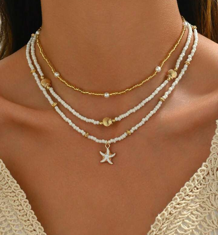 SET 3 PEZZI COLLANA CON PERLE DI RISO, STELLE MARINE E CONCHIGLIE DORATE